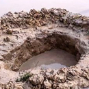 Photo: India farmers shocked as suspected meteorite crashes into rice field