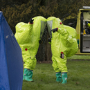 Investigators in Hazmat suits